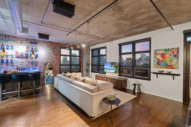 a room with lots of furniture and a large window