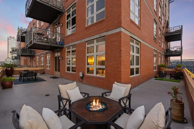a view of a patio with a table and chairs