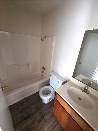 a bathroom with a sink a toilet and bathtub