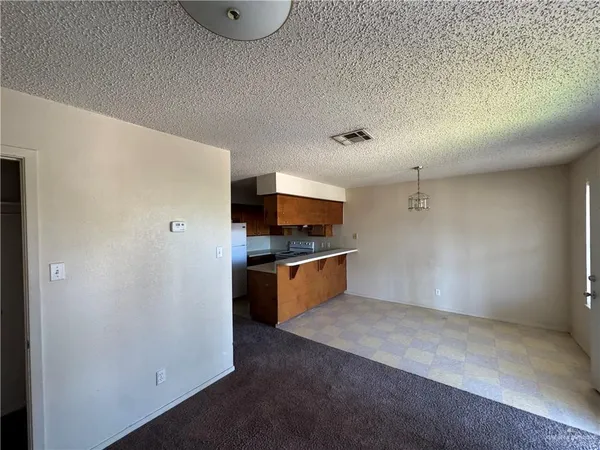 a view of a kitchen with a sink and dishwasher