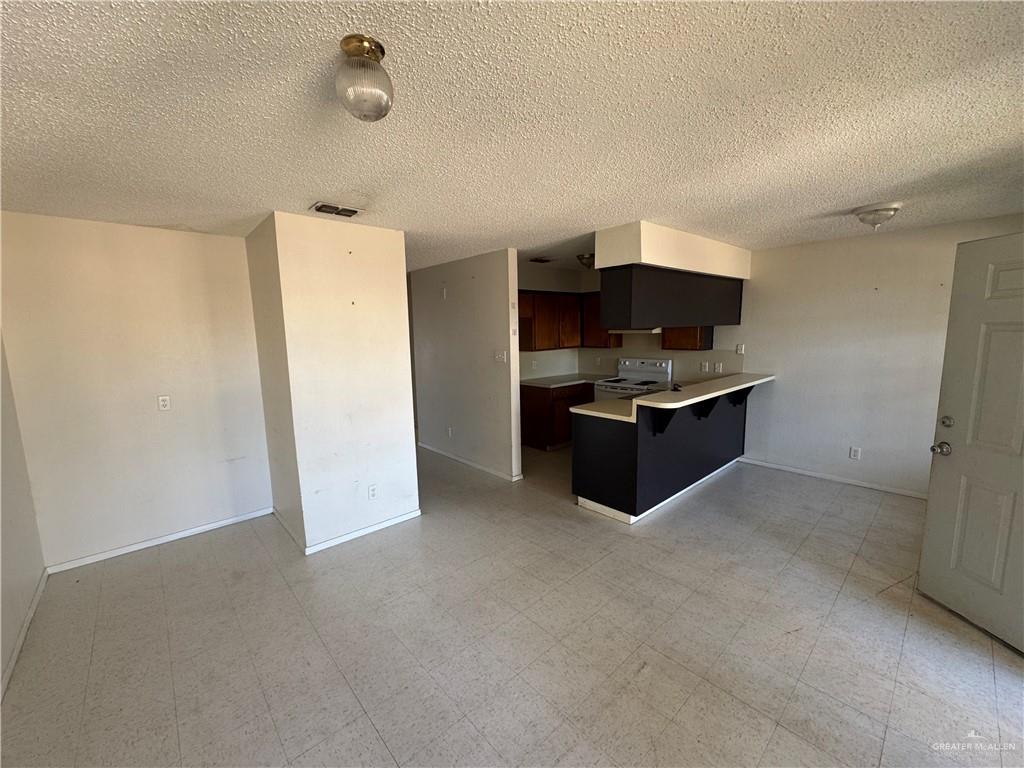 1810 Jason Avenue Edinburg, TX 78539 - Photo 18 of 27 a kitchen with refrigerator and cabinet