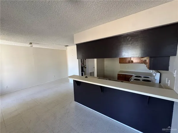 a kitchen with stainless steel appliances a sink stove and refrigerator