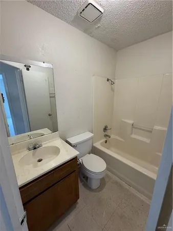 a bathroom with a sink mirror toilet and bathtub
