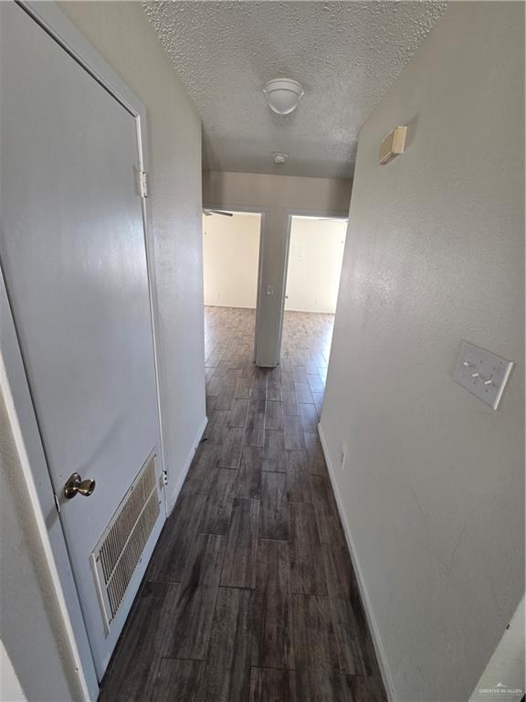 1810 Jason Avenue Edinburg, TX 78539 - Photo 10 of 27 a view of a hallway with wooden floor