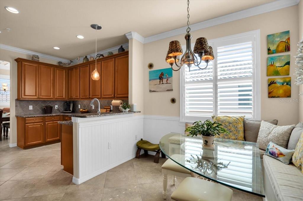 20201 Ragazza Circle, Unit 201 Venice, FL 34293 - Photo 25 of 58 a view of kitchen with stainless steel appliances granite countertop sink stove and cabinets