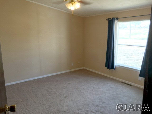 532 34 Road, Unit A Clifton, CO 81520 - Photo 7 of 11 an empty room with a window