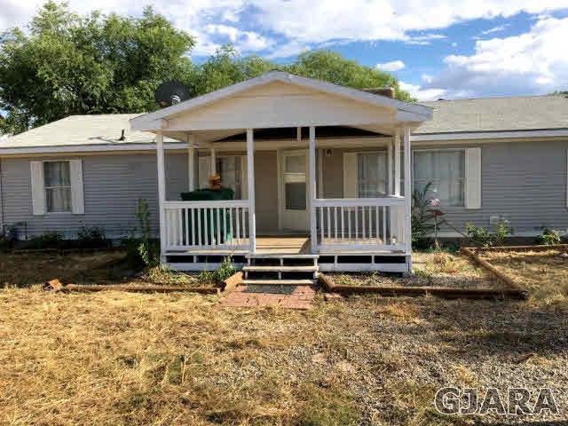 532 34 Road, Unit A Clifton, CO 81520 - Photo 10 of 11 a front view of a house with a yard