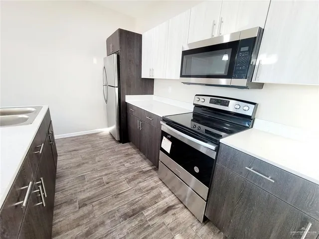 a kitchen with a stove and a microwave