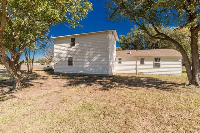 a picture of a bench in front of a wall