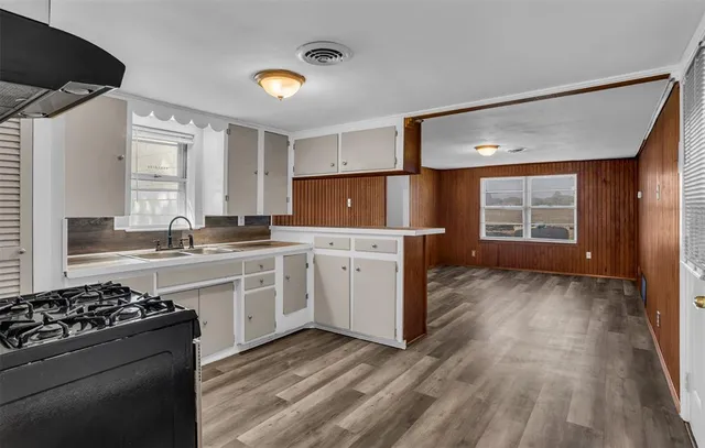a kitchen with a stove and a refrigerator