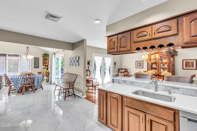 a kitchen with stainless steel appliances granite countertop a sink and cabinets