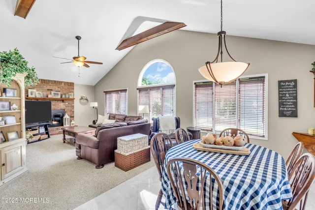 a bedroom with furniture a chandelier and a window