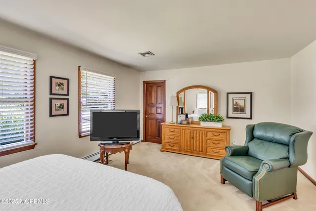a bedroom with furniture and window