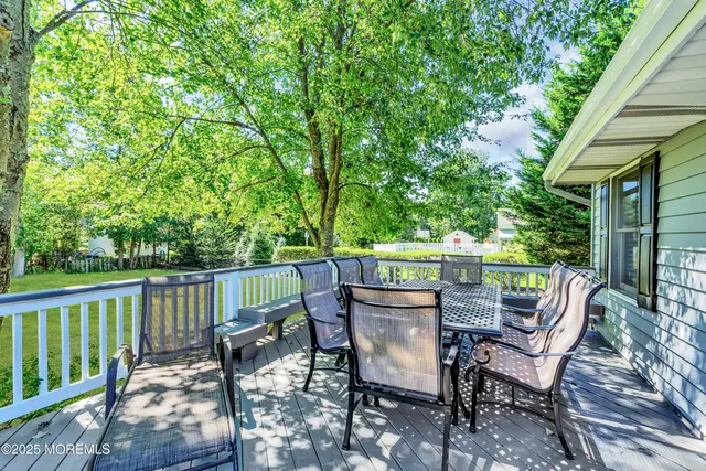a view of a chairs and table in the balcony