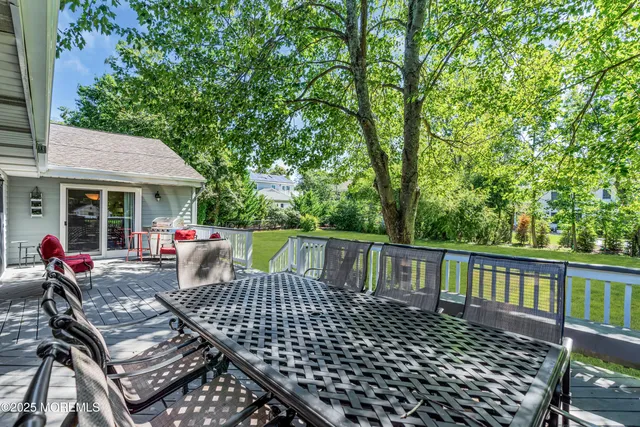 a view of a patio with wooden floor