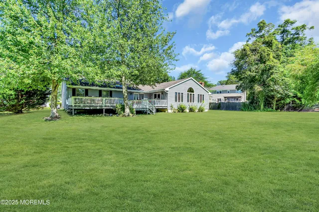 a view of a house with a big yard