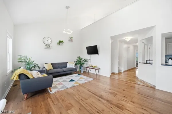 a view of a livingroom with furniture and wooden floor