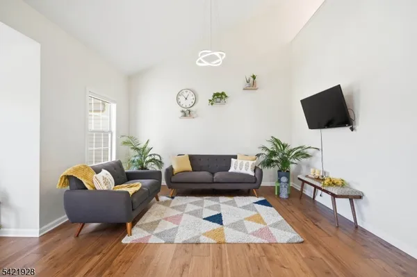 a kitchen with stainless steel appliances granite countertop a stove a refrigerator and a microwave