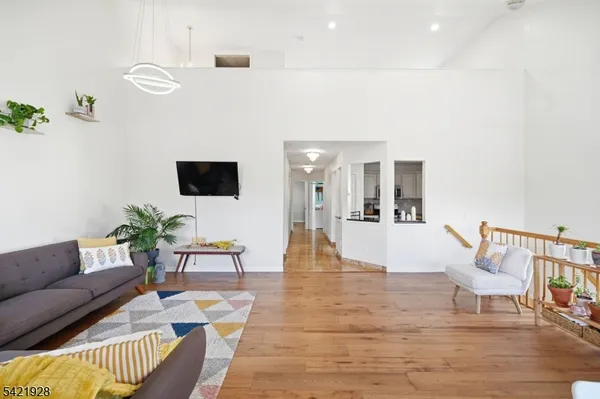 a kitchen with stainless steel appliances granite countertop a stove a refrigerator and a refrigerator