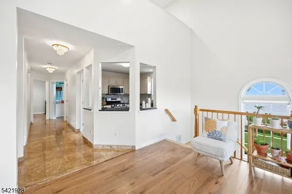 a bathroom with a sink a toilet a mirror and shower