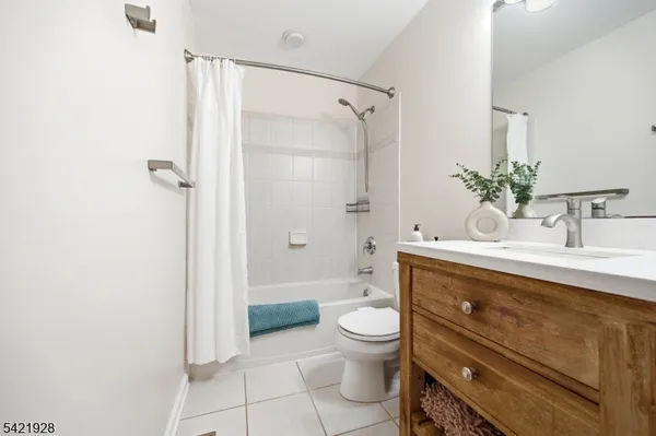 a bathroom with a toilet a sink and a mirror