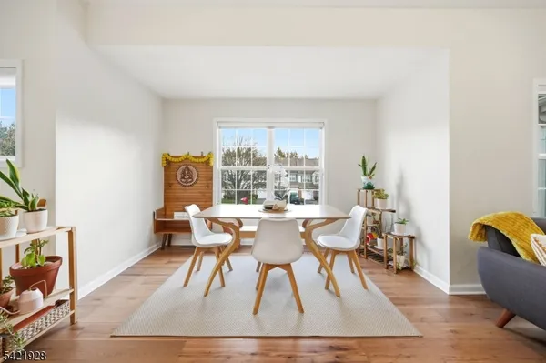 a bedroom with a bed and a view of living room
