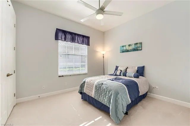 a bed room with a bed and a window