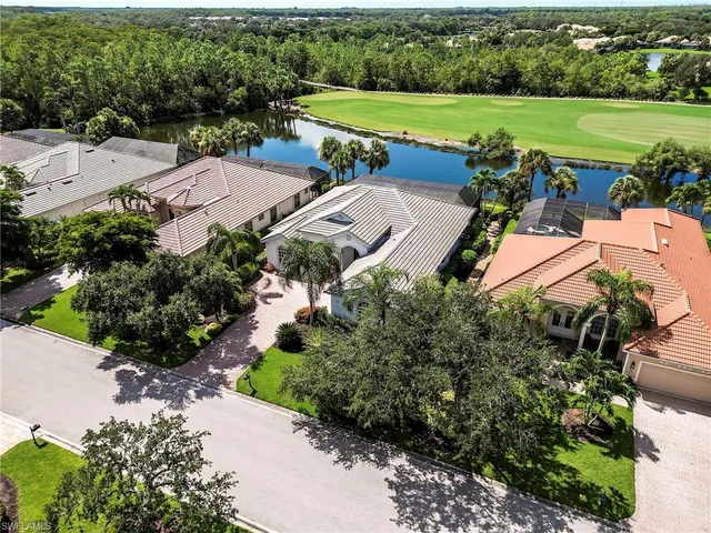 an aerial view of a house with outdoor space and street view