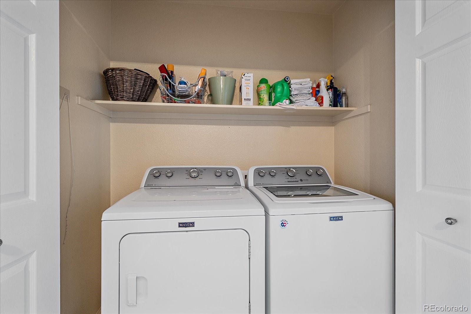 6318 Trailhead Road Highlands Ranch, CO 80130 - Photo 24 of 32 a utility room with dryer and washer