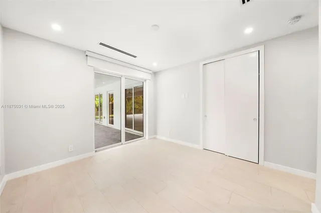 a bathroom with a bathtub a sink a window and a shower