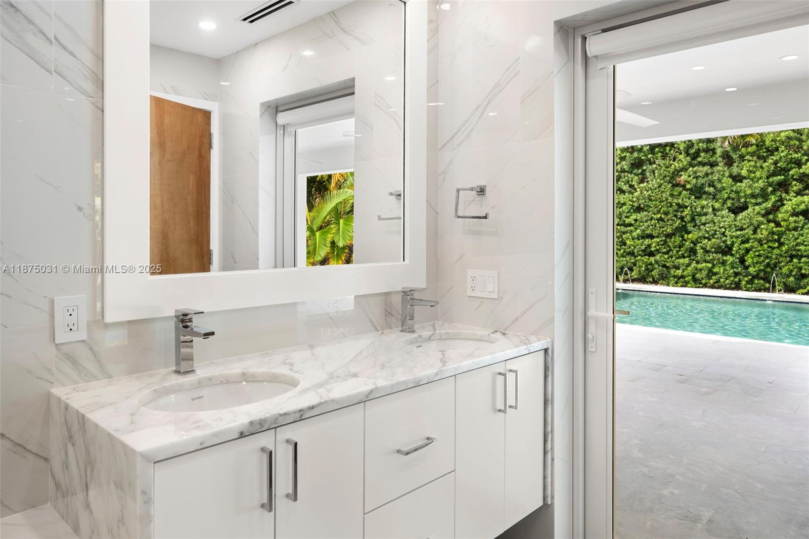 4380 Lake Road Miami, FL 33137 - Photo 29 of 61 a bathroom with a sink and a mirror