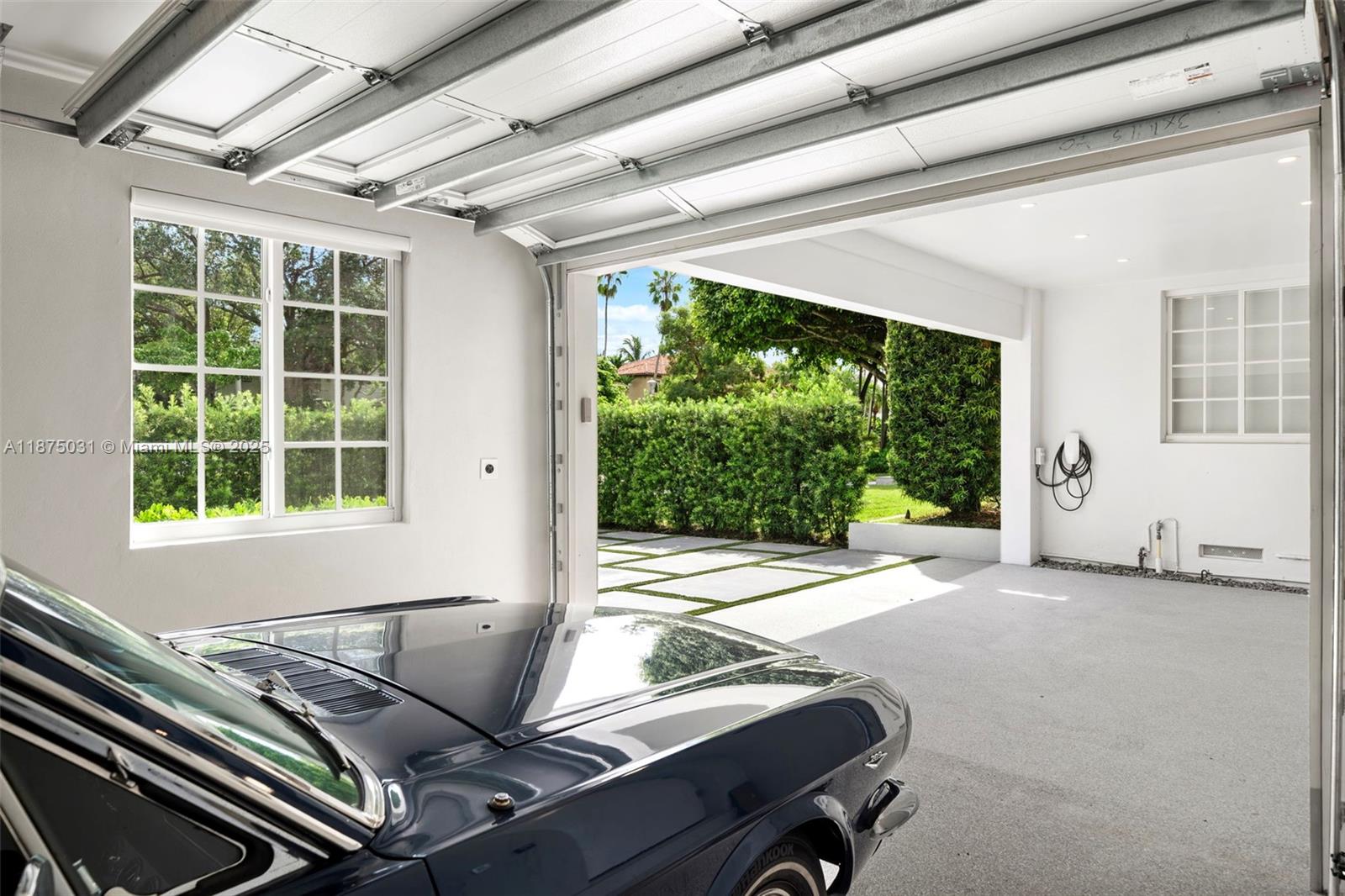 4380 Lake Road Miami, FL 33137 - Photo 33 of 61 a bed sitting in a room next to a window