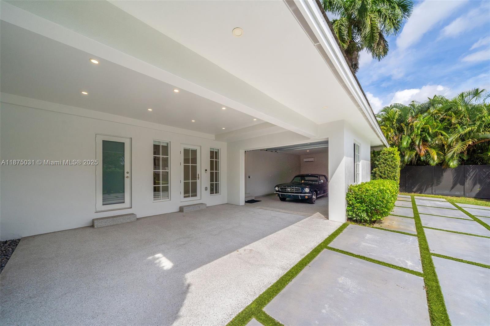 4380 Lake Road Miami, FL 33137 - Photo 35 of 61 a view of a house with porch and furniture