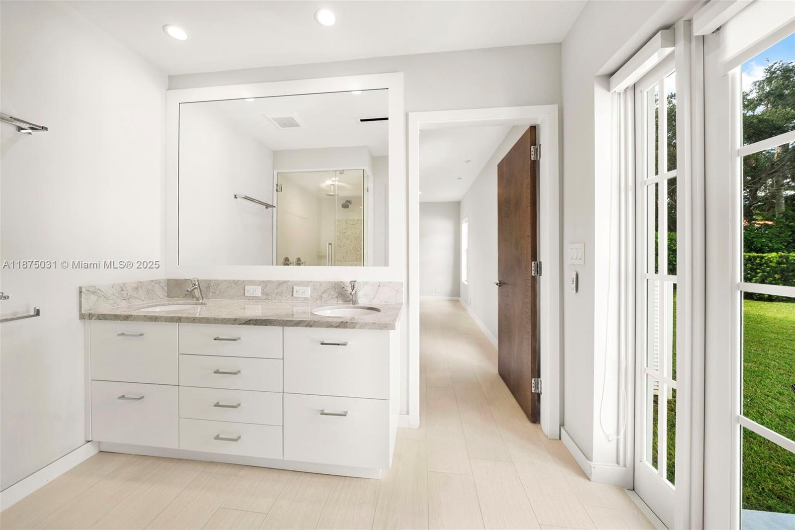 4380 Lake Road Miami, FL 33137 - Photo 42 of 61 a bathroom with a granite countertop sink mirror and a