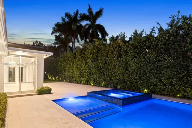 an aerial view of a house with a garden
