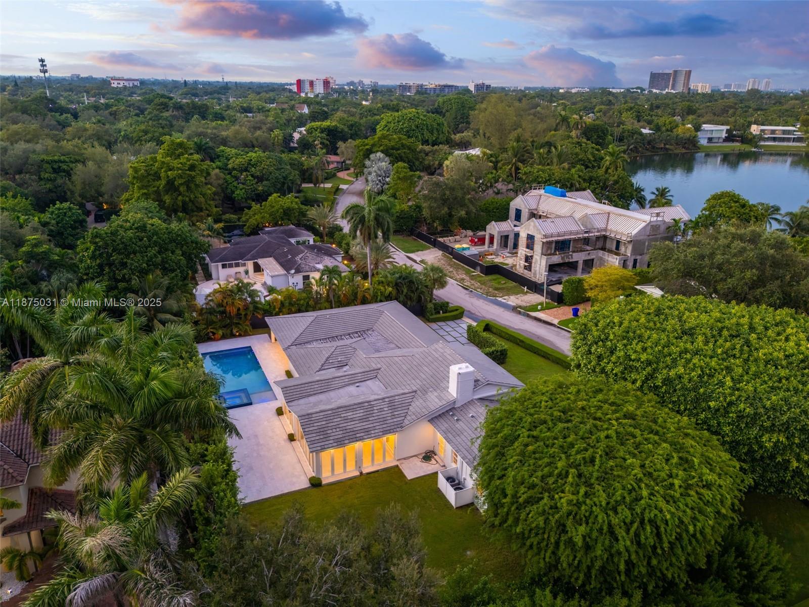 4380 Lake Road Miami, FL 33137 - Photo 56 of 61 an aerial view of a house with a garden and lake view