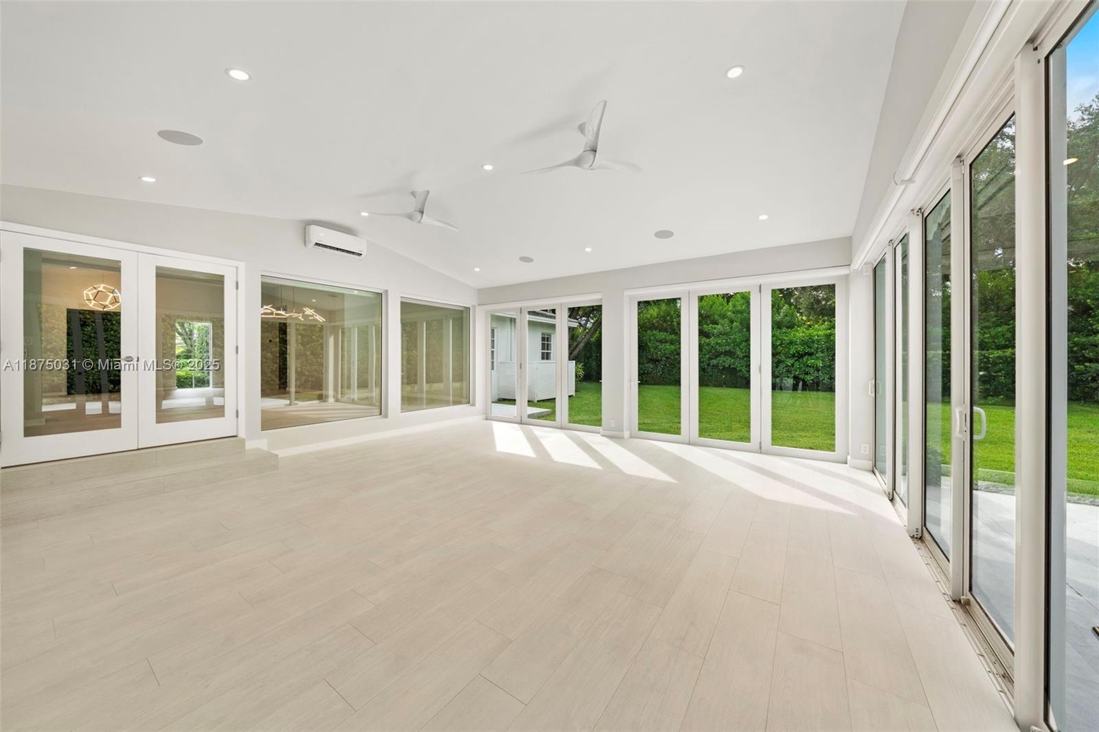 4380 Lake Road Miami, FL 33137 - Photo 8 of 61 a view of an empty room with windows and balcony