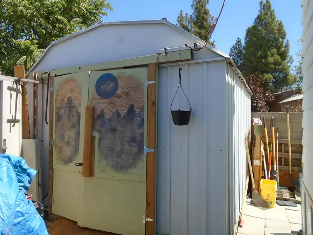 a outdoor space with a table and chairs