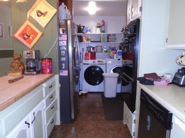 a kitchen with a sink and a stove top oven