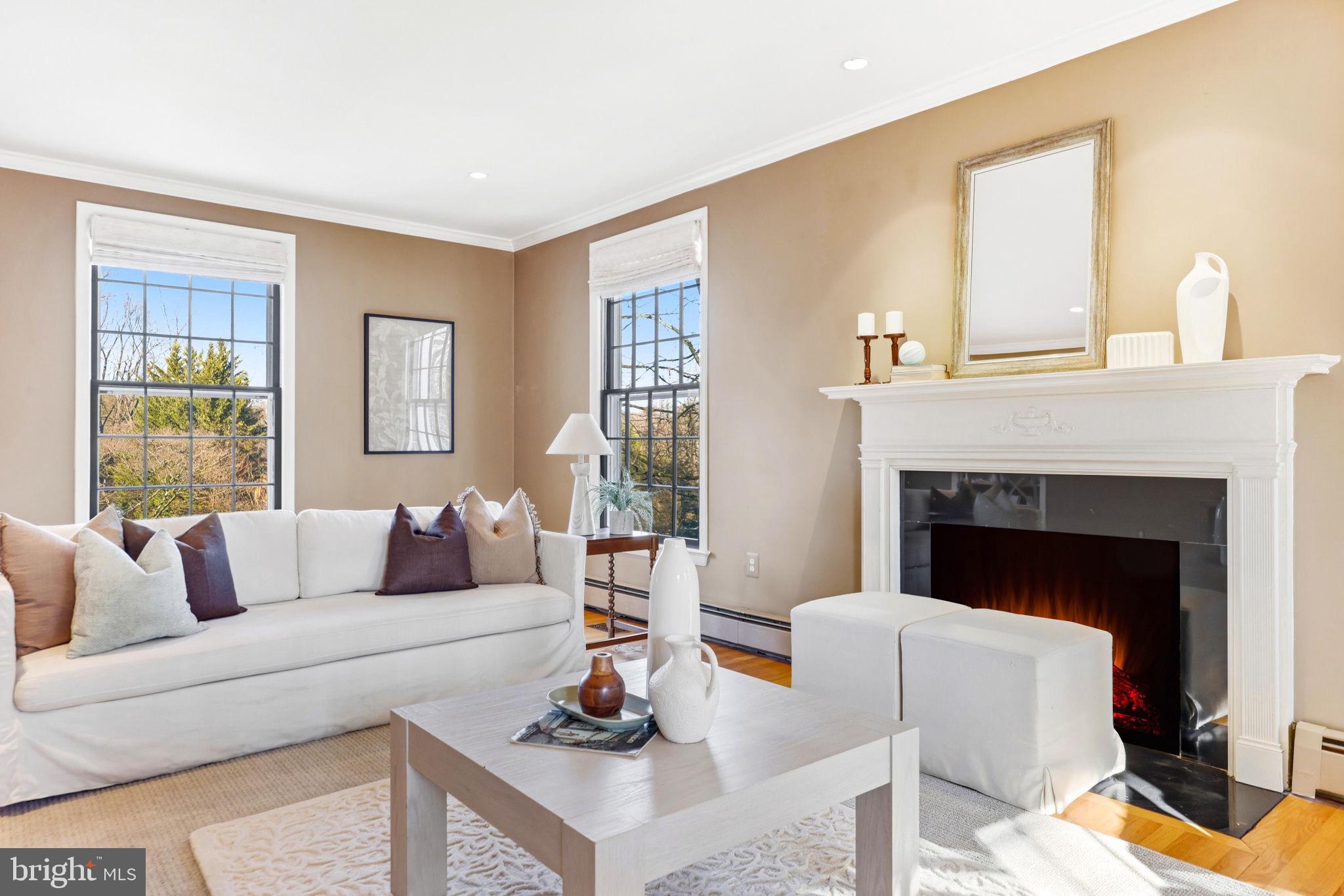 9101 Warfield Road Gaithersburg, MD 20882 - Photo 12 of 44 a living room with furniture and a fireplace