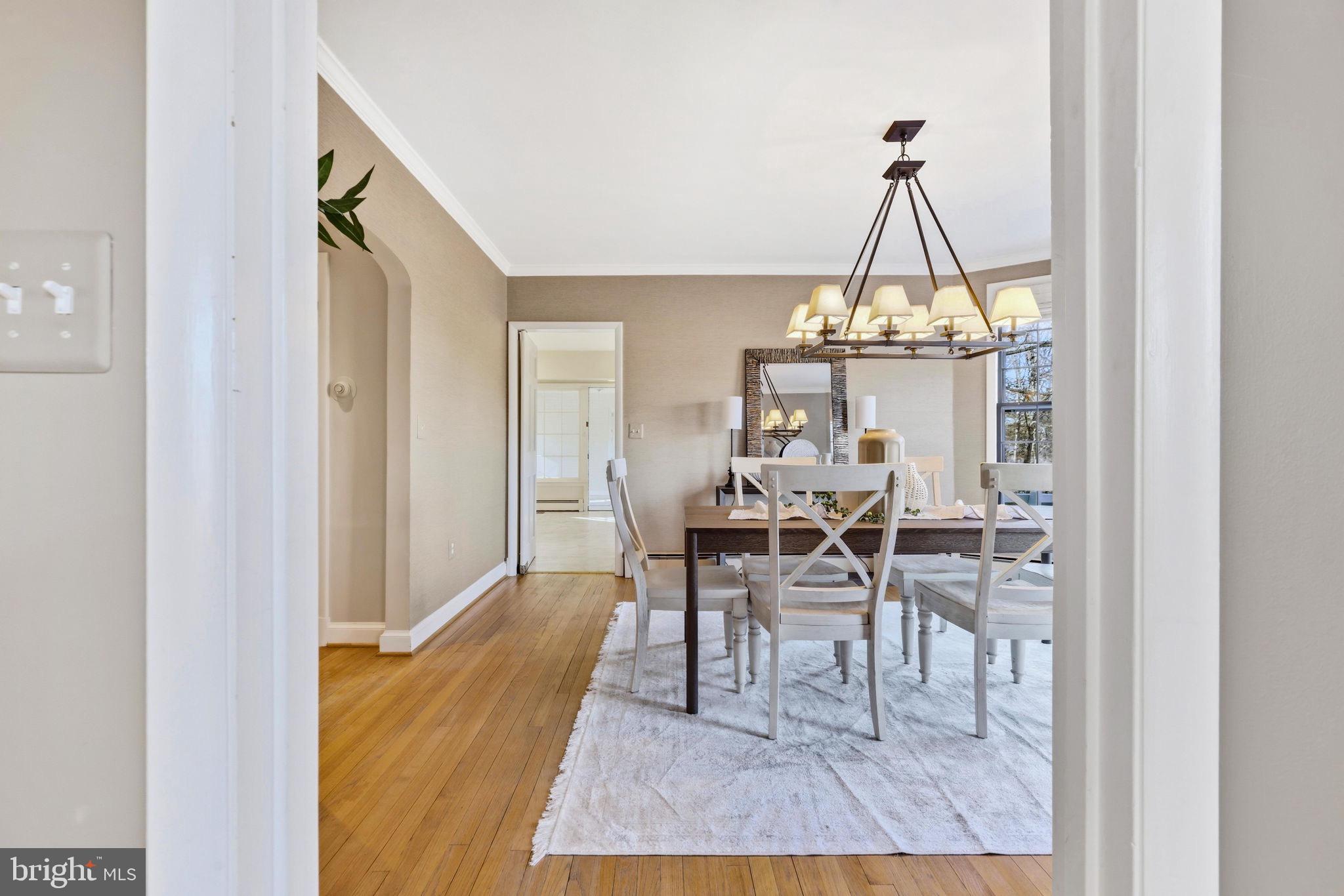 9101 Warfield Road Gaithersburg, MD 20882 - Photo 13 of 44 a dining room with a table and chairs