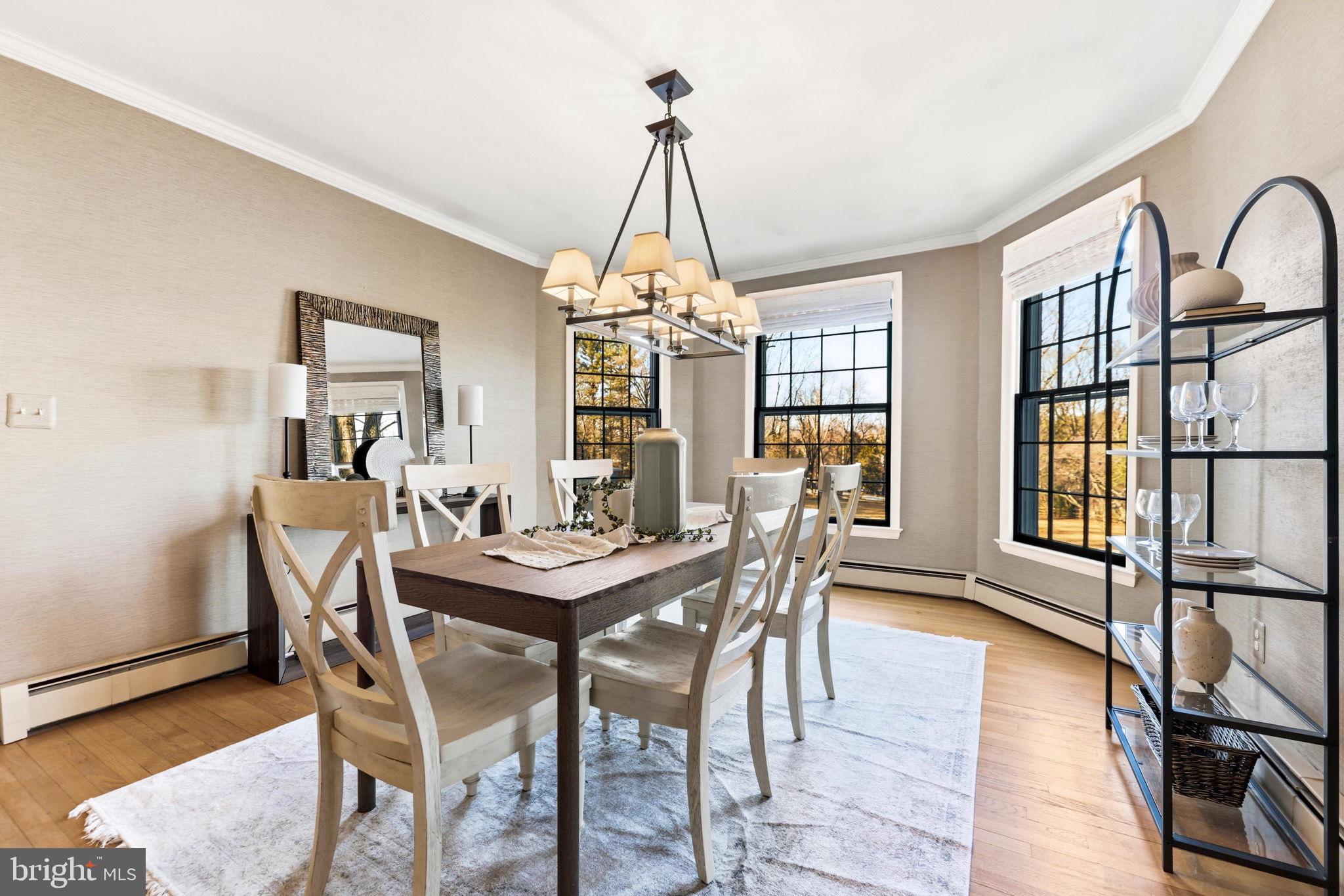 9101 Warfield Road Gaithersburg, MD 20882 - Photo 15 of 44 a dining room with furniture window and wooden floor