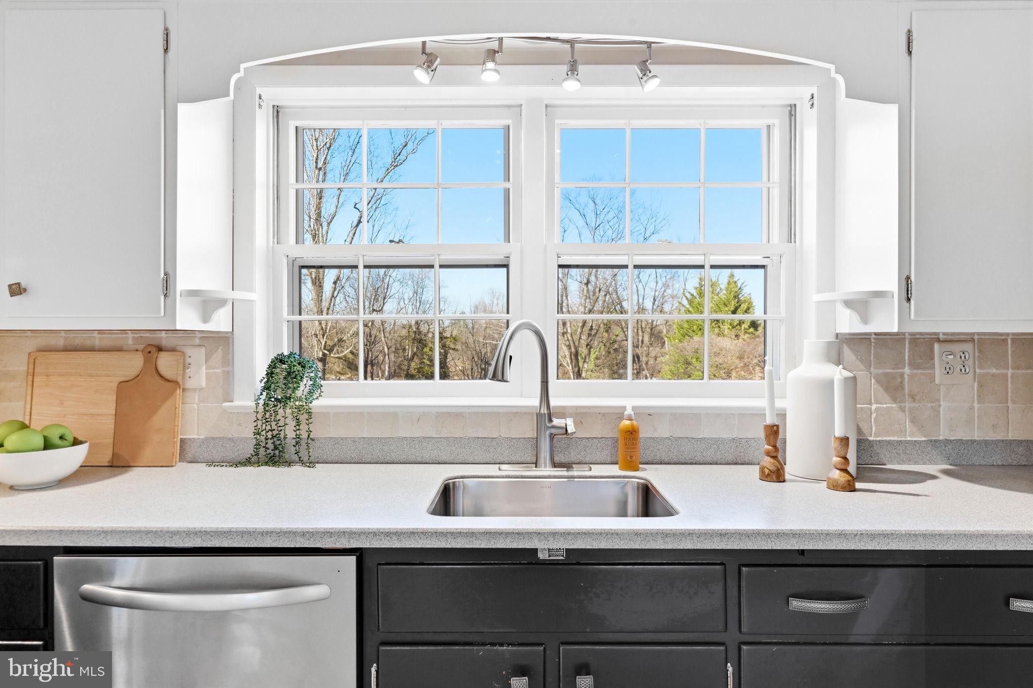 9101 Warfield Road Gaithersburg, MD 20882 - Photo 18 of 44 a kitchen with a sink and window