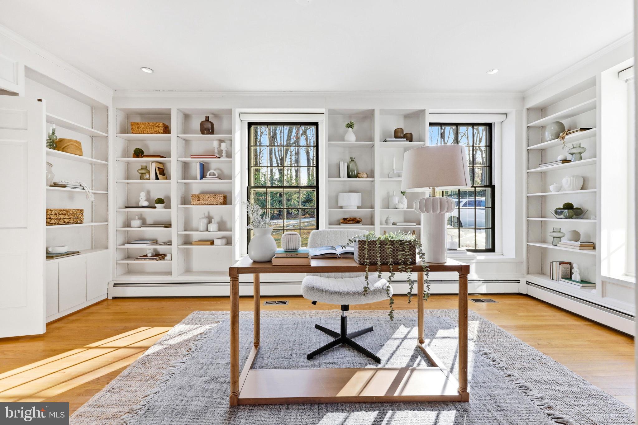 9101 Warfield Road Gaithersburg, MD 20882 - Photo 19 of 44 a living room with furniture a rug and white walls