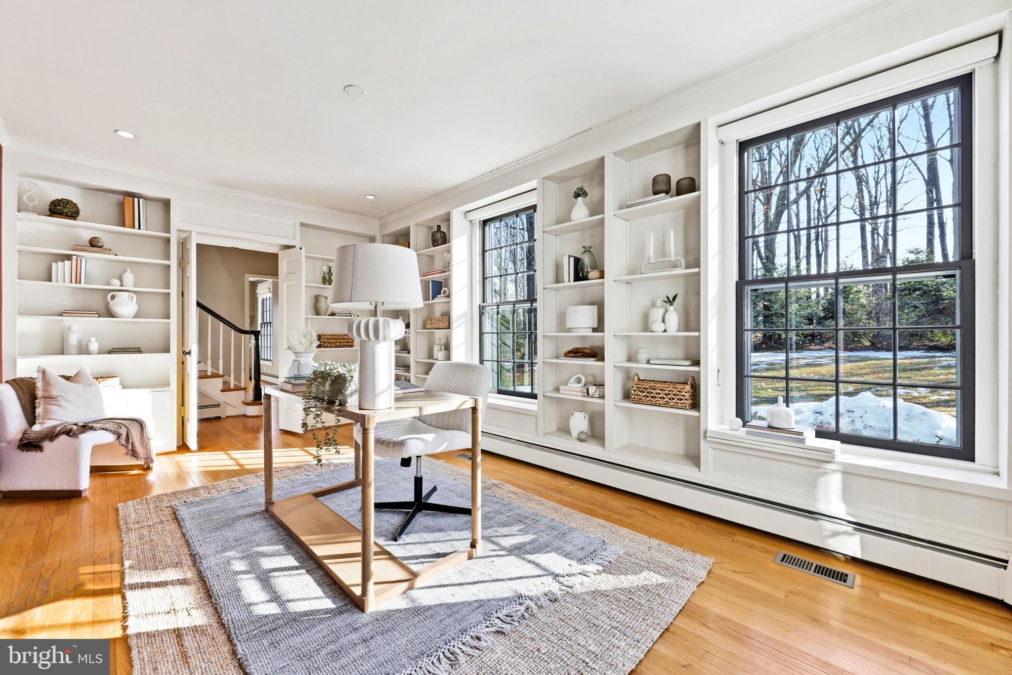 9101 Warfield Road Gaithersburg, MD 20882 - Photo 20 of 44 a living room with furniture and a table