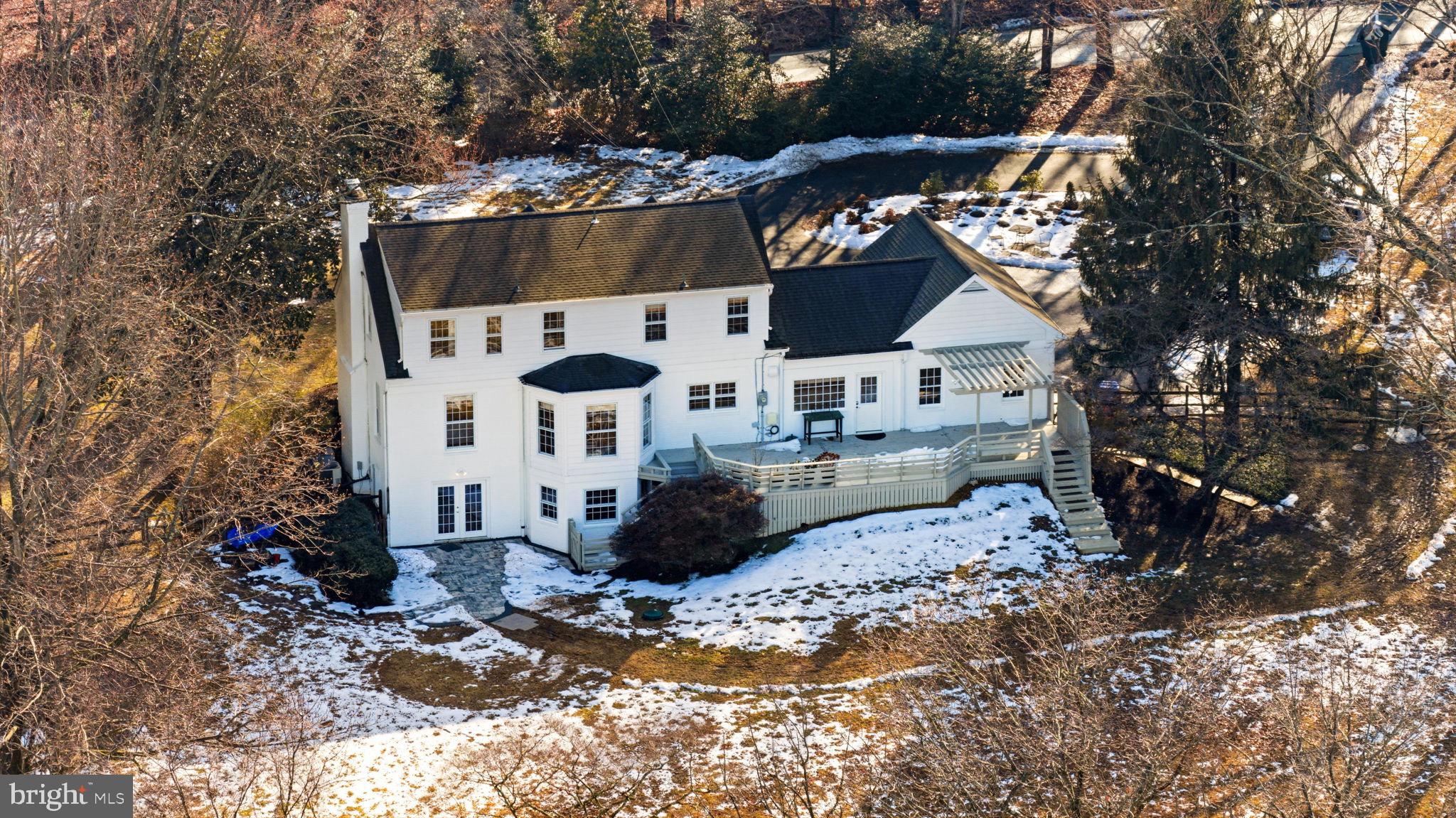 9101 Warfield Road Gaithersburg, MD 20882 - Photo 2 of 44 a view of a house with a yard