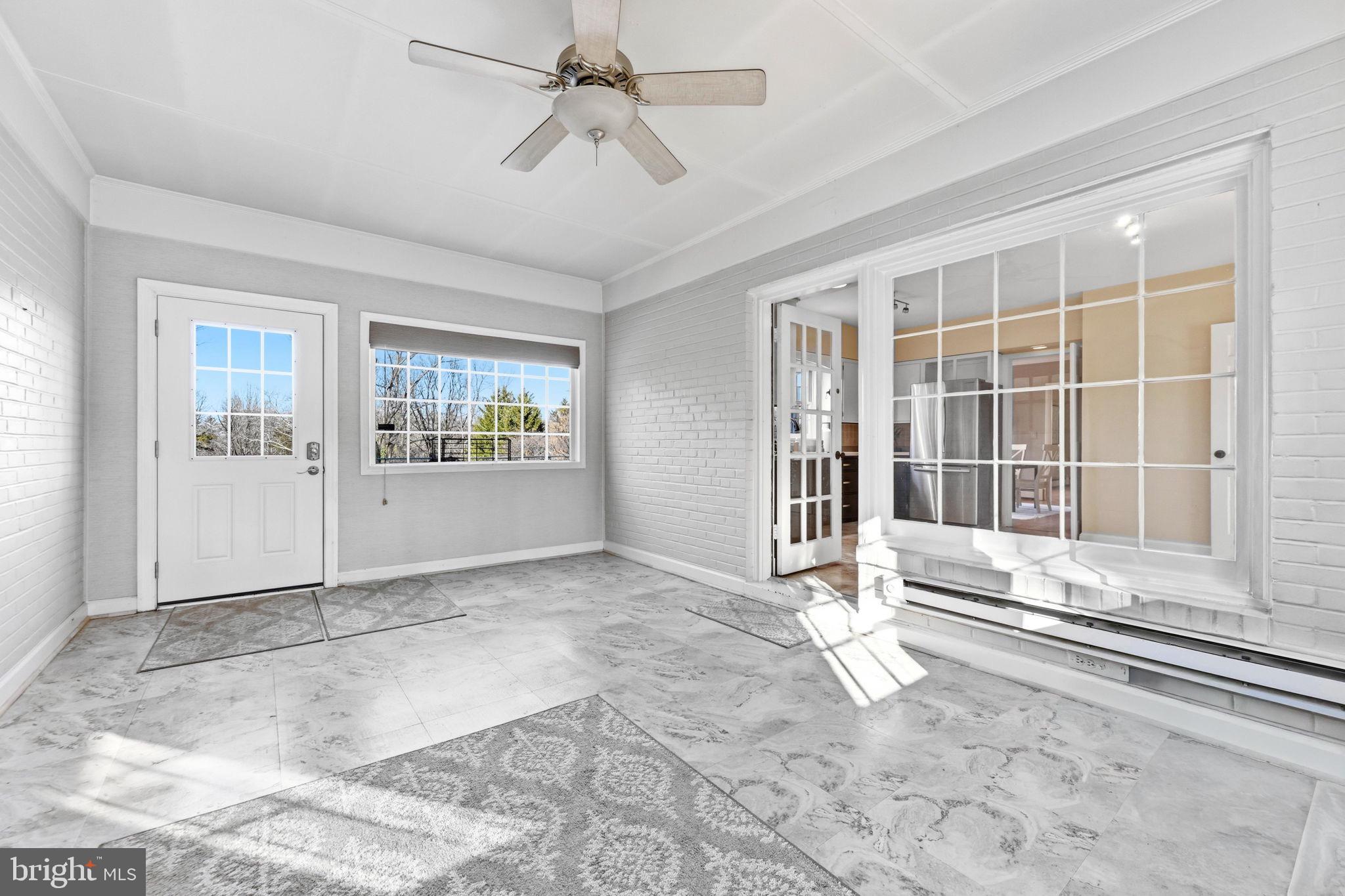 9101 Warfield Road Gaithersburg, MD 20882 - Photo 23 of 44 a view of an empty room with a window
