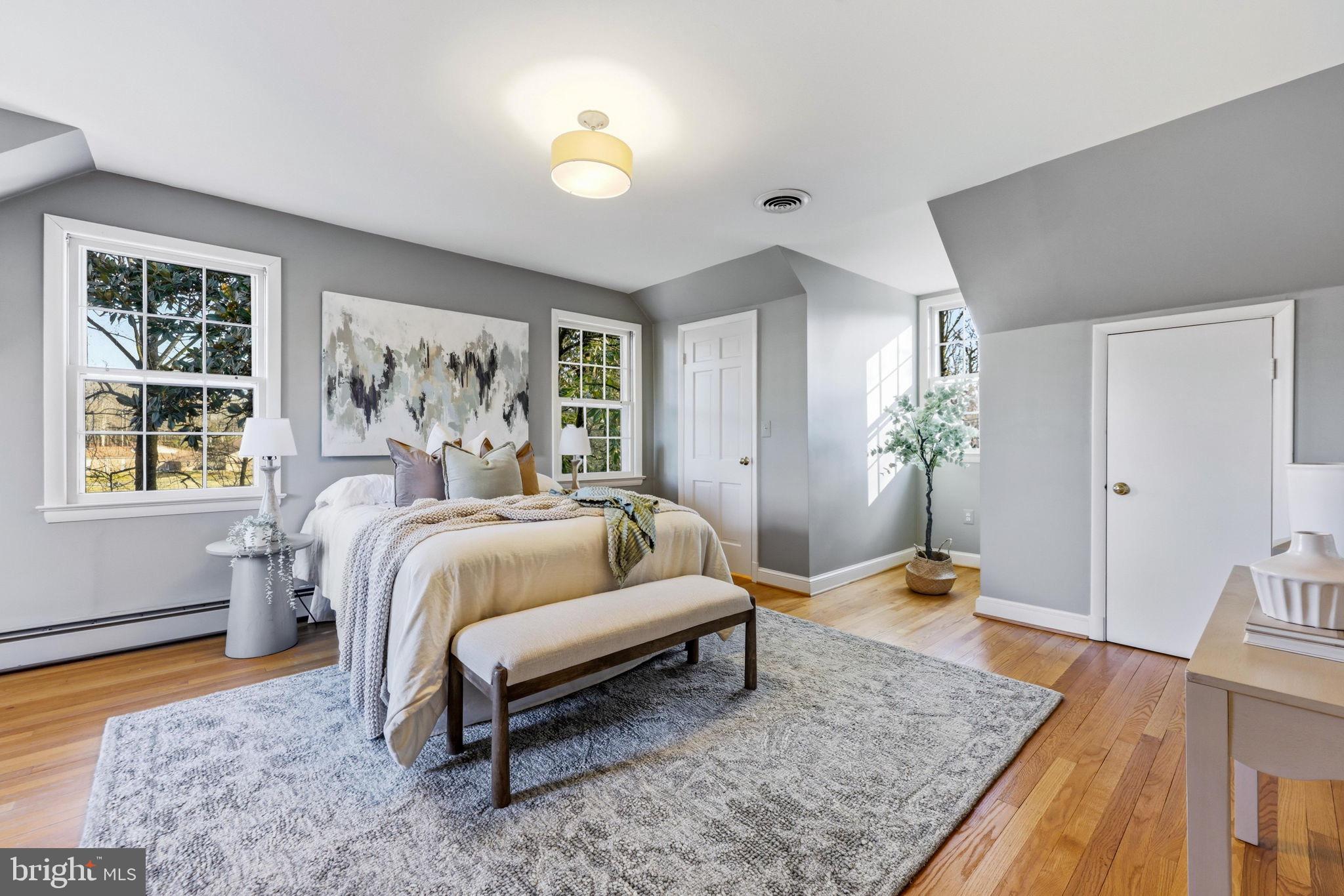 9101 Warfield Road Gaithersburg, MD 20882 - Photo 24 of 44 a bedroom with a bed and window