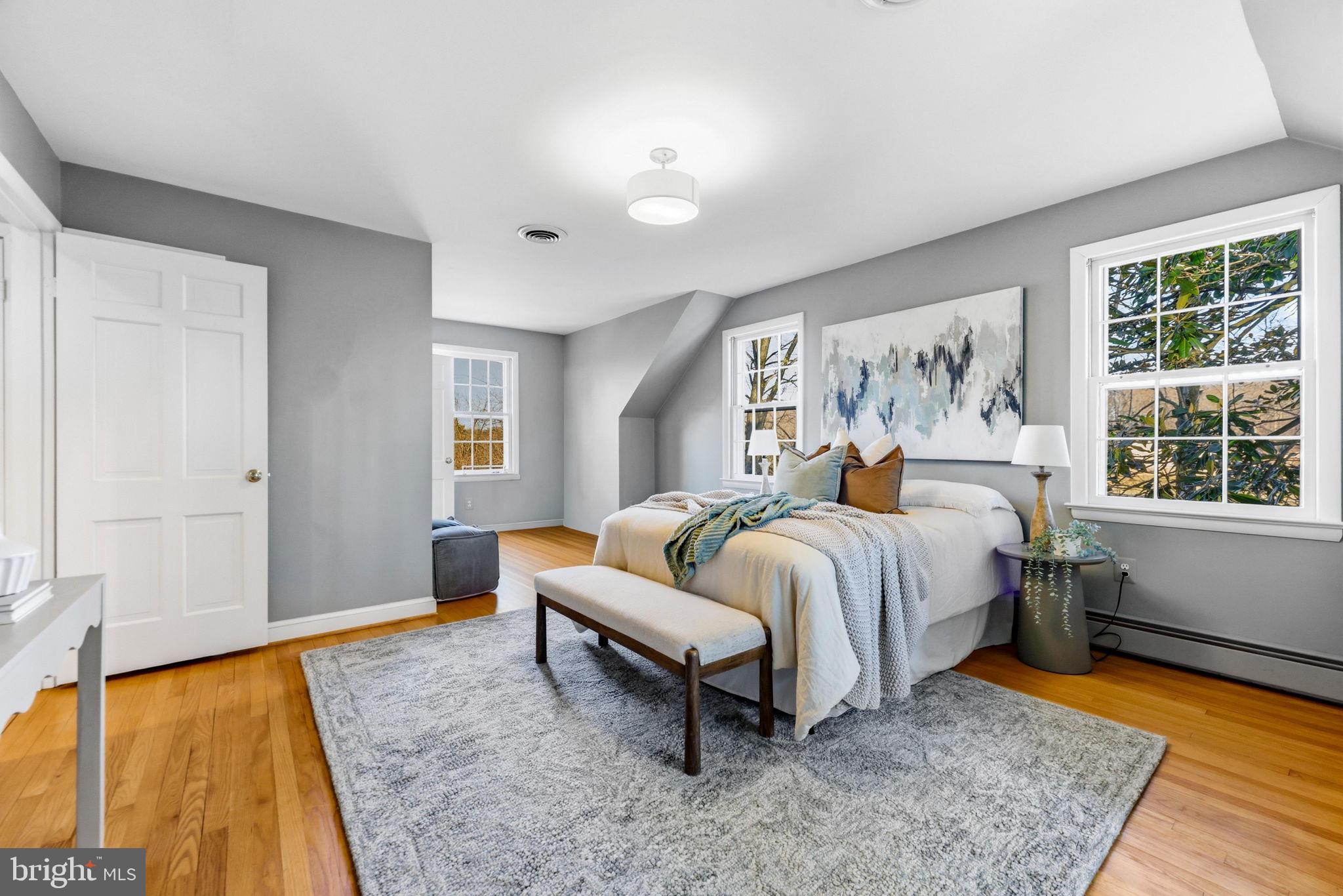 9101 Warfield Road Gaithersburg, MD 20882 - Photo 25 of 44 a spacious bedroom with a bed and a window with outer view