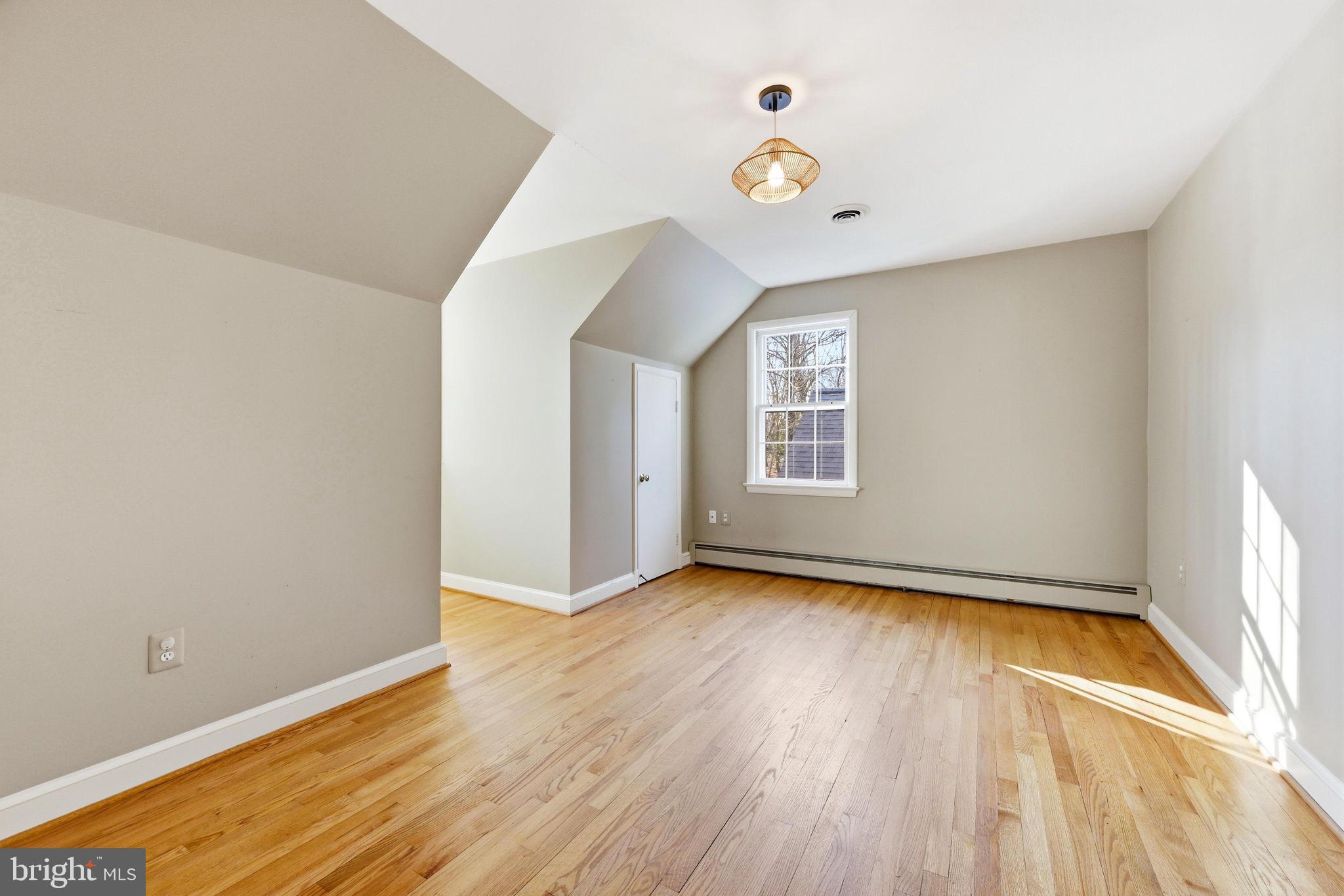 9101 Warfield Road Gaithersburg, MD 20882 - Photo 27 of 44 a view of a room with wooden floor and window